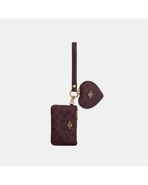 Wristlet And Heart Pouch In Signature Canvas