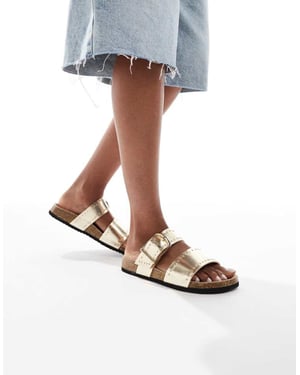ASOS DESIGN Fallon sandaler med nitar och fotbädd i guld