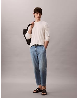 Calvin Klein Jeans 90-talets tapered jeans i solblekt tvätt