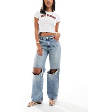 ASOS DESIGN låg midja baggy jeans med hål i ljus mellanblå