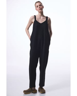 Getailleerde V-hals Rechtaflopende Jumpsuit Met Zakjes