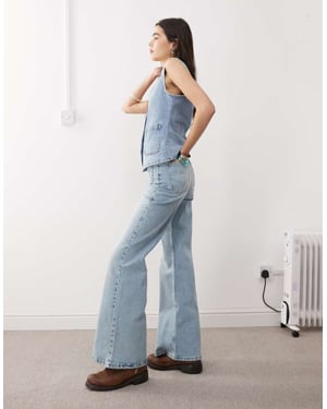 Reclaimed Vintage denim 70s palazzo jean with patch pockets and button fly detail in blue wash