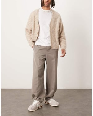 ASOS DESIGN dra på smarta vida byxor med knappar i fåll i dämpad khaki