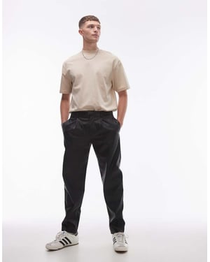 Topman tapered faux leather trousers in black
