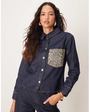 ASOS DESIGN denim oversized shirt with leopard print pocket in indigo