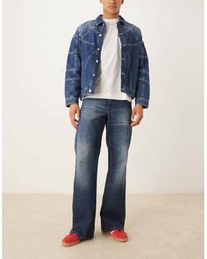 ASOS DESIGN vida utsvängda jeans med toning i mörk tvättad blå