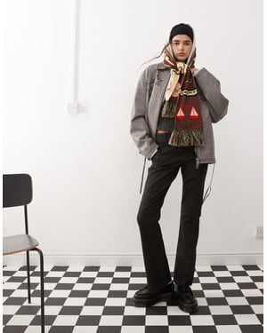 COLLUSION low rise pinstripe kick flare trousers in black