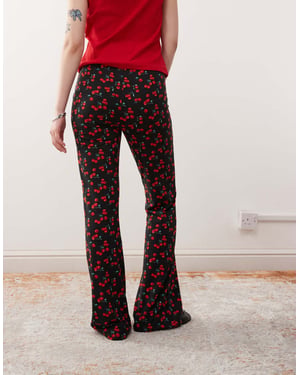 Noisy May Petite flare trouser in cherry print - BLACK