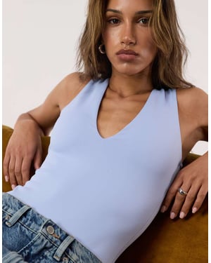 Good American sculpting deep v tank bodysuit in sky mist