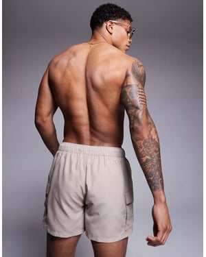 ASOS DESIGN swim shorts in short length with cargo pockets in stone