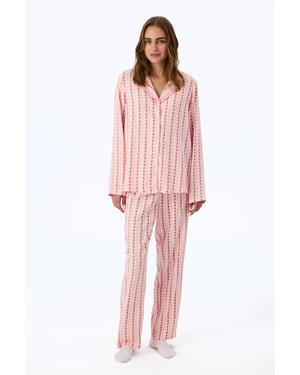 Lätt pyjamaset med blommönster, volanger, långärmad skjorta och byxor