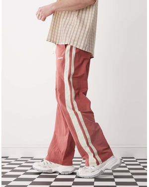 Prohibited stripe trackpants in red