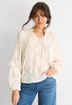 Långärmad blus med blommor i krämfärgad jacquard