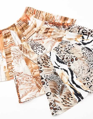 Reclaimed Vintage Revived x Glass Onion festival mini skirt in mixed print