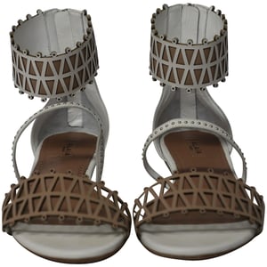 Alaia Ankle-cuff Laser Cut Sandals In White Leather