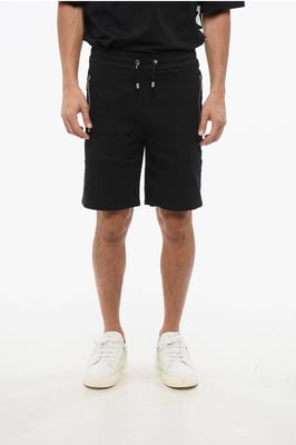 Svarta jerseyshorts med sidologotyp och band