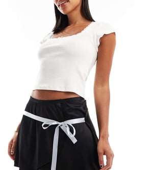 Daisy Street mini flippy skirt in black stretch satin with blue ribbon detail
