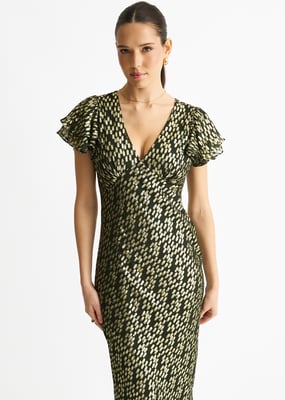 Mörkgrön viskosklänning med guldjacquard och snedskuren maxilängd