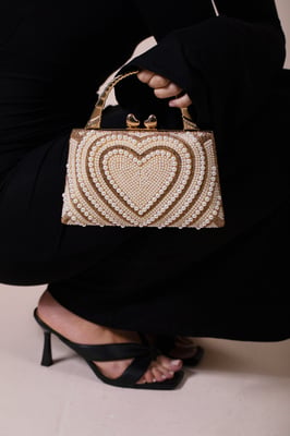 Heart Pearl Clutch Bag In Gold
