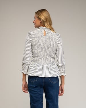 Blouse met lange mouwen, gestreept met honingraatborduursel op de borst en manchetten.