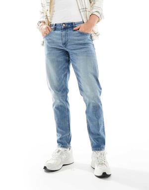 ASOS DESIGN – Blå stretchiga, avsmalnande jeans med mellanblå tvätt