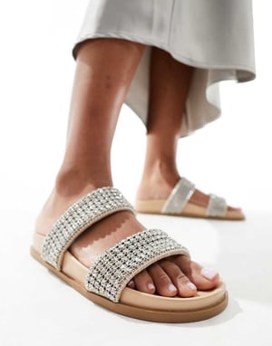 Schuh – Tessie-utsmyckade tofflor i neutralt material