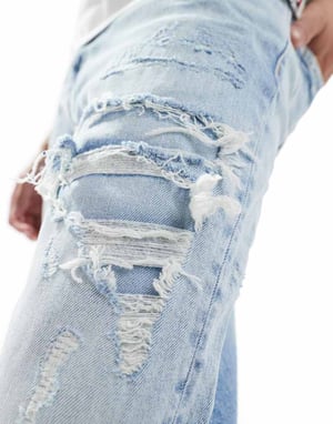 Tommy Jeans – Isaac – Ljustvättade avsmalnande jeans med slitning