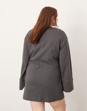 ASOS EDITION Curve – Mörkgrön miniklänning i premiumjersey med långa ärmar