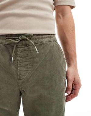 ASOS DESIGN tapered fit cord trouser with elasticated waist in khaki