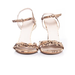 Gucci Neutral colored python sandal.