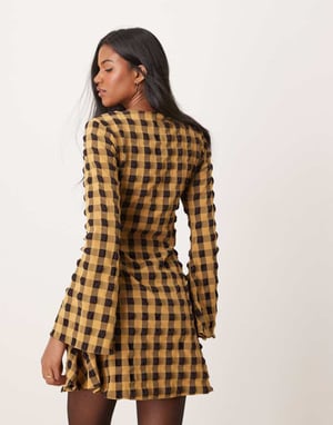 ASOS DESIGN textured mini dress with fluted sleeve in black and yellow check