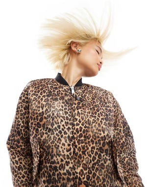 Monki reversibel oversized bomberjacka i svart kviltad stjärn- och leopardmönster