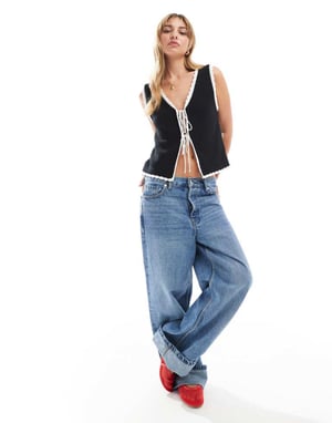ASOS DESIGN stickad väst med kontrasterande kant i svart