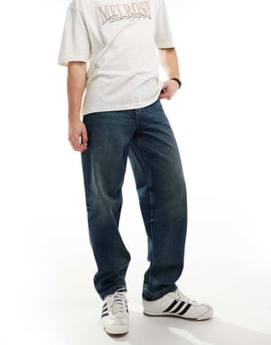 ASOS DESIGN baggy jeans med slitningar i mörkblå tvätt