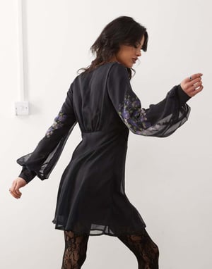 Reclaimed Vintage mini tea dress with floral placement print in black
