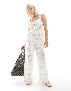 Återvunnen vintage jumpsuit med knappar i pricken-blommigt mönster