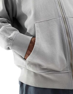 ASOS DESIGN unisex oversized zip hoodie i tvättad ljusblå