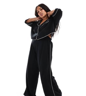 ASOS DESIGN Curve supersoft slinky vidbenad pyjamabyxa i svart med kontrasterande detaljer