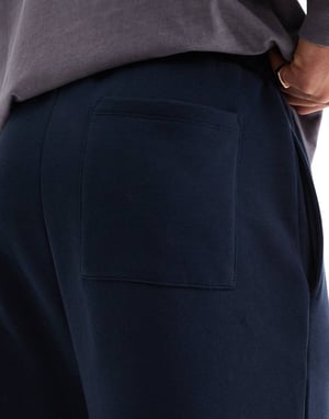 ASOS DESIGN vid bens jogger med veck i marinblå