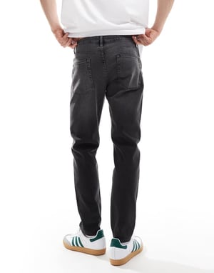 ASOS DESIGN tapered jeans i tvättad svart med toning
