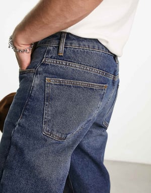 ASOS DESIGN tapered fit jeans i mörk vintage tvätt - MBLUE
