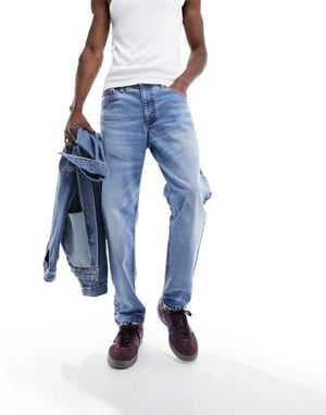 ASOS DESIGN tapered fit jeans i ljus TVÄTTAD blå - LBLUE