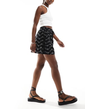 ASOS DESIGN broderie shorts with tie pockets in black/white