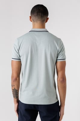 Light Green Textured Polo Shirt With Button-Up And Logo Badge