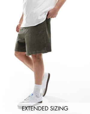 ASOS DESIGN överdimensionerade ribbade velourshorts i mörkgrön