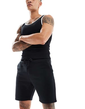 COLLUSION jersey shorts i svart