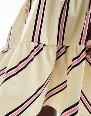 ASOS DESIGN kjol med volanger i knälängd i gult och rosa randig