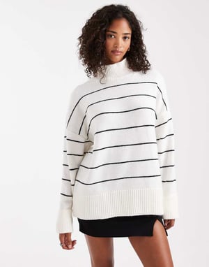ASOS DESIGN stickad höghalshals tröja med vändbara muddar i monostrip.