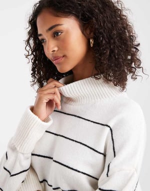 ASOS DESIGN stickad höghalshals tröja med vändbara muddar i monostrip.