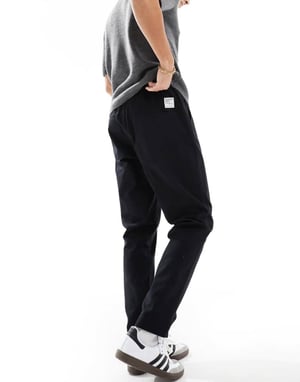 ASOS DESIGN tapered pull on trousers in black with patch